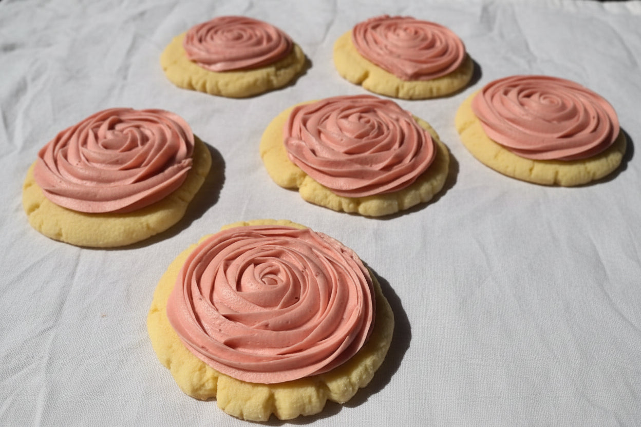 Lemon cookies with pink raspberry buttercream rosettes 